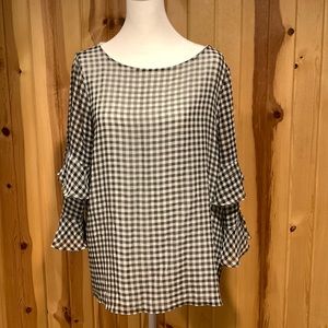 Calvin Klein black and white blouse with ruffled sleeves. Lined. Worn once.